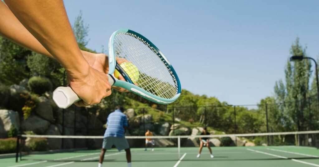 An arm of the tennis player getting ready to serve showing the good effects of tennis wrist exercises
