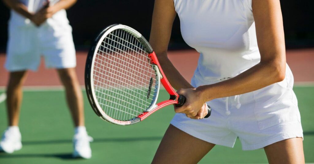 two tennis players getting ready to play to shgow what is soft tennis