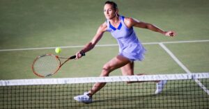 A tennis player about to hit a ball from one side to another showing the effects of good agility exercises for tennis