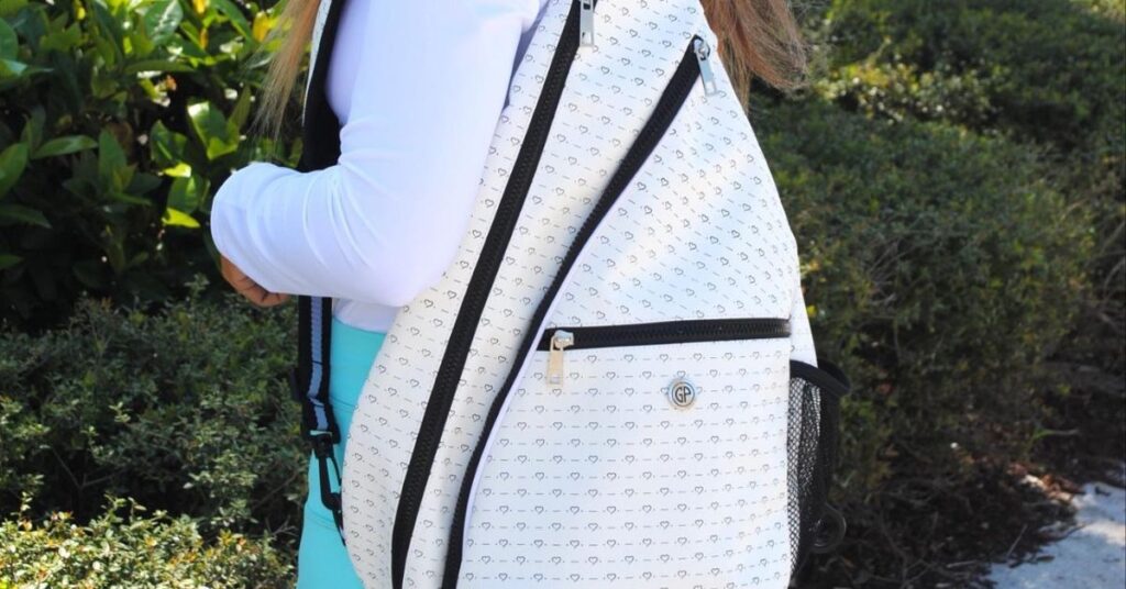 A white bag at the bag of a tennis player, one of the best best tennis coach gifts